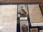 Display of letters and photographs, one showing Tolstoy as a young man