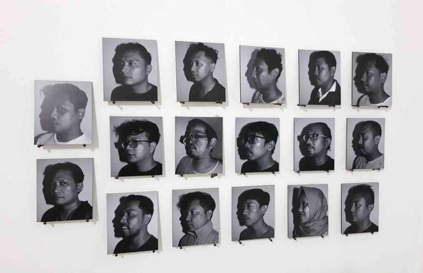 Black and white portraits of photography collective members, 16 men and one woman