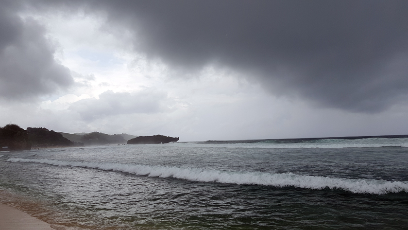 Seascape with gathering grey clouds above