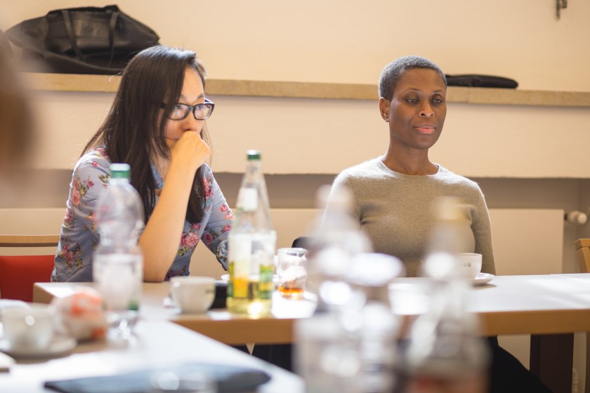 Two women sit at a table for script reading