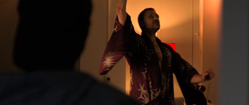 Over Orin's shoulder shot of Anto standing in his kimono