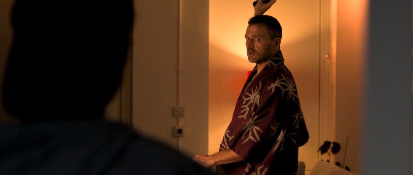 Over Orin's shoulder shot of Anto standing in his kimono