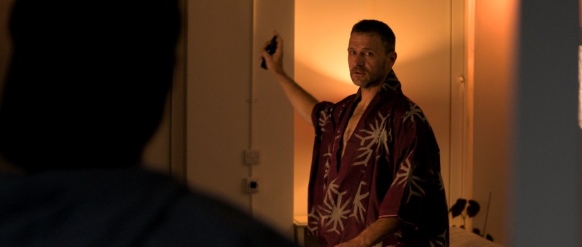 Over Orin's shoulder shot of Anto standing in his kimono