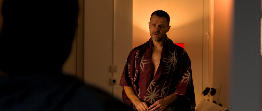Over Orin's shoulder shot of Anto standing in his kimono