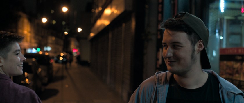 Orin on the street exchanges glances with another nonbinary person as they pass