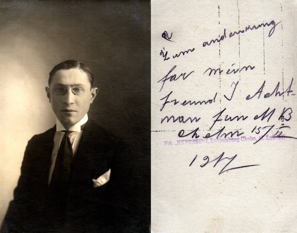 Sepia studio portrait of a young man in a suit and pince-nez, shown beside the reverse with a handwritten German dedication and studio stamp.